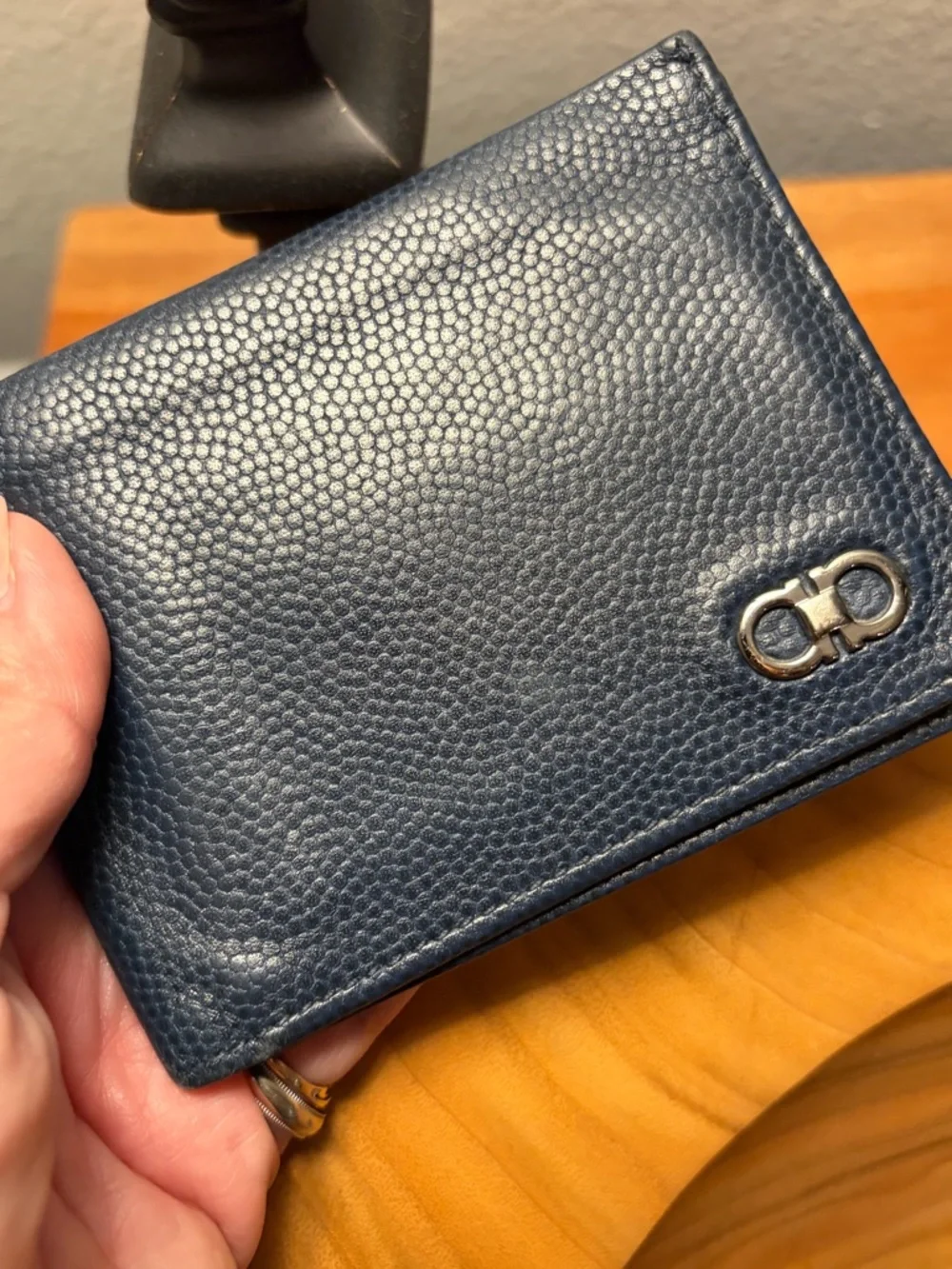 Salvatore Ferragamo men's textured leather bifold wallet with Gancini logo